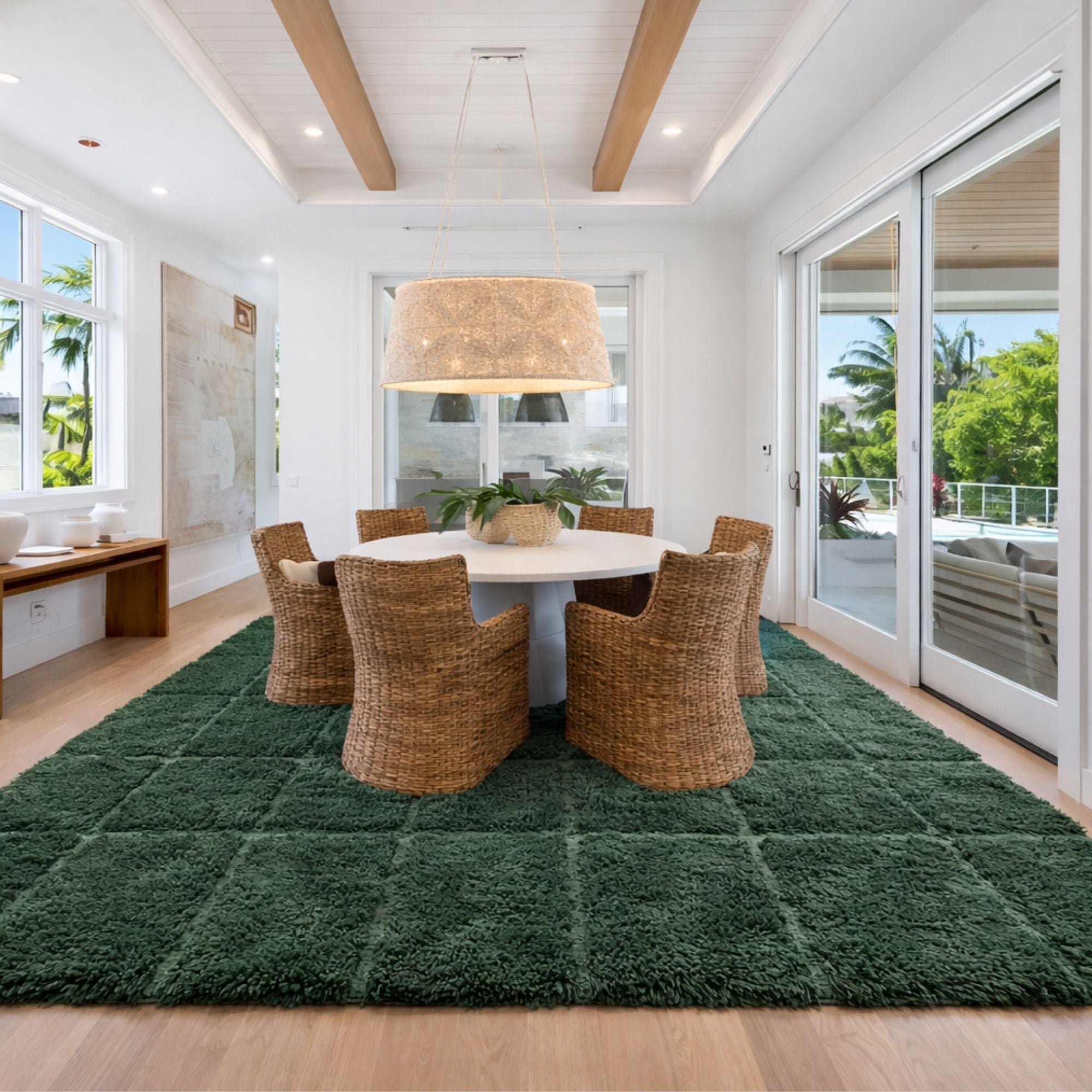 Handwoven Moroccan wool rug, Understory design, forest green grid styled in a bright dining room.