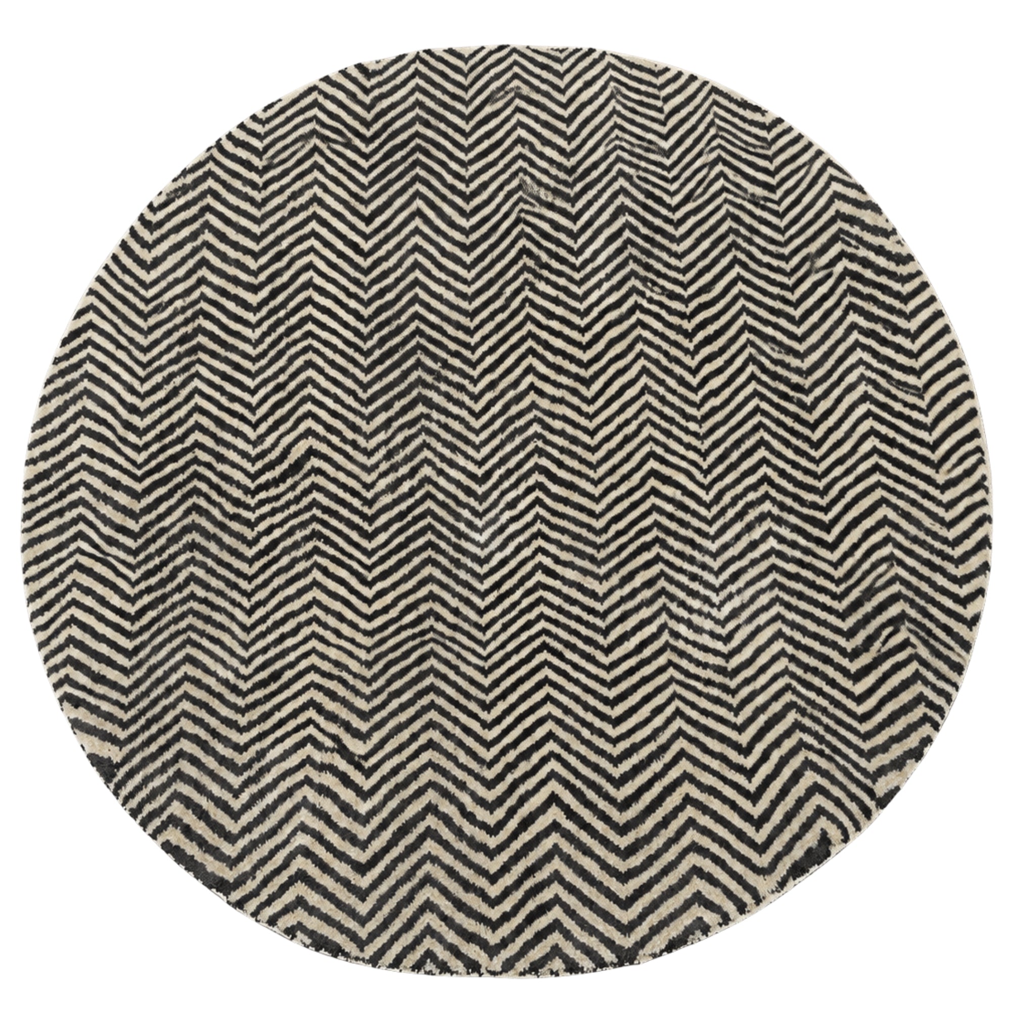 Handwoven Moroccan wool rug, Undertow design, round black and ivory hand-drawn chevron pattern, flat-woven texture.