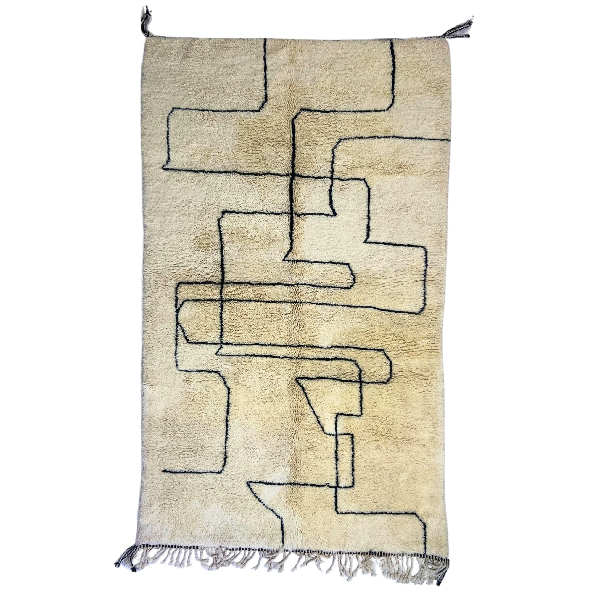 White shag Moroccan rug with a bold black contemporary design, handwoven by Berber artisans.