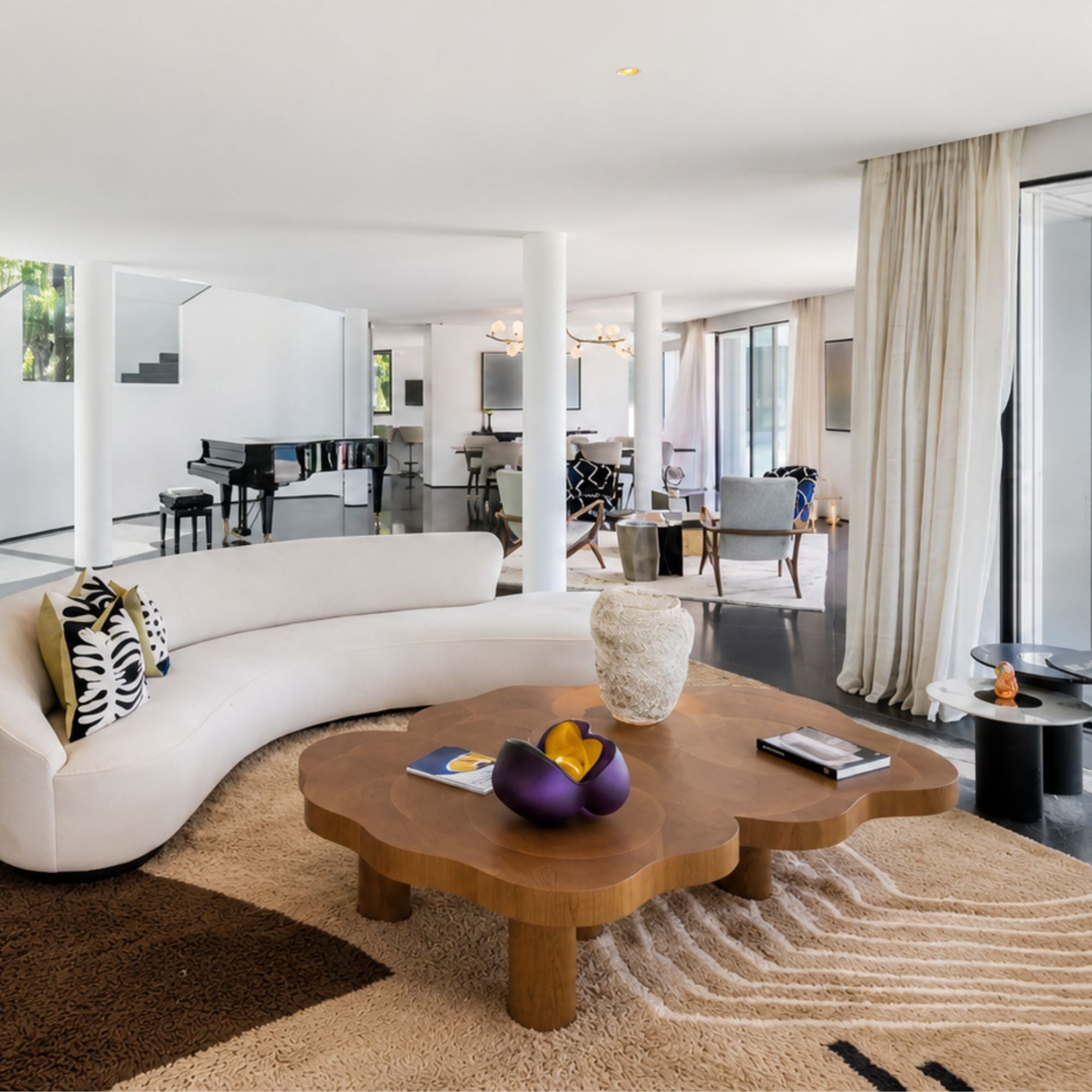 Luxury abstract Moroccan wool rug styled beneath a sculptural coffee table, highlighting soft texture and earthy brown color blocking.