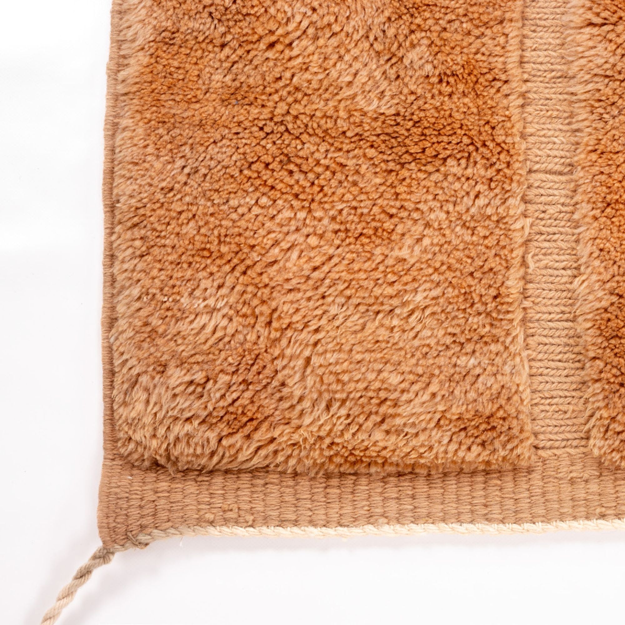 Medina Magic brown Berber rug with a camel brown base and tribal textured design, handwoven by Berber artisans