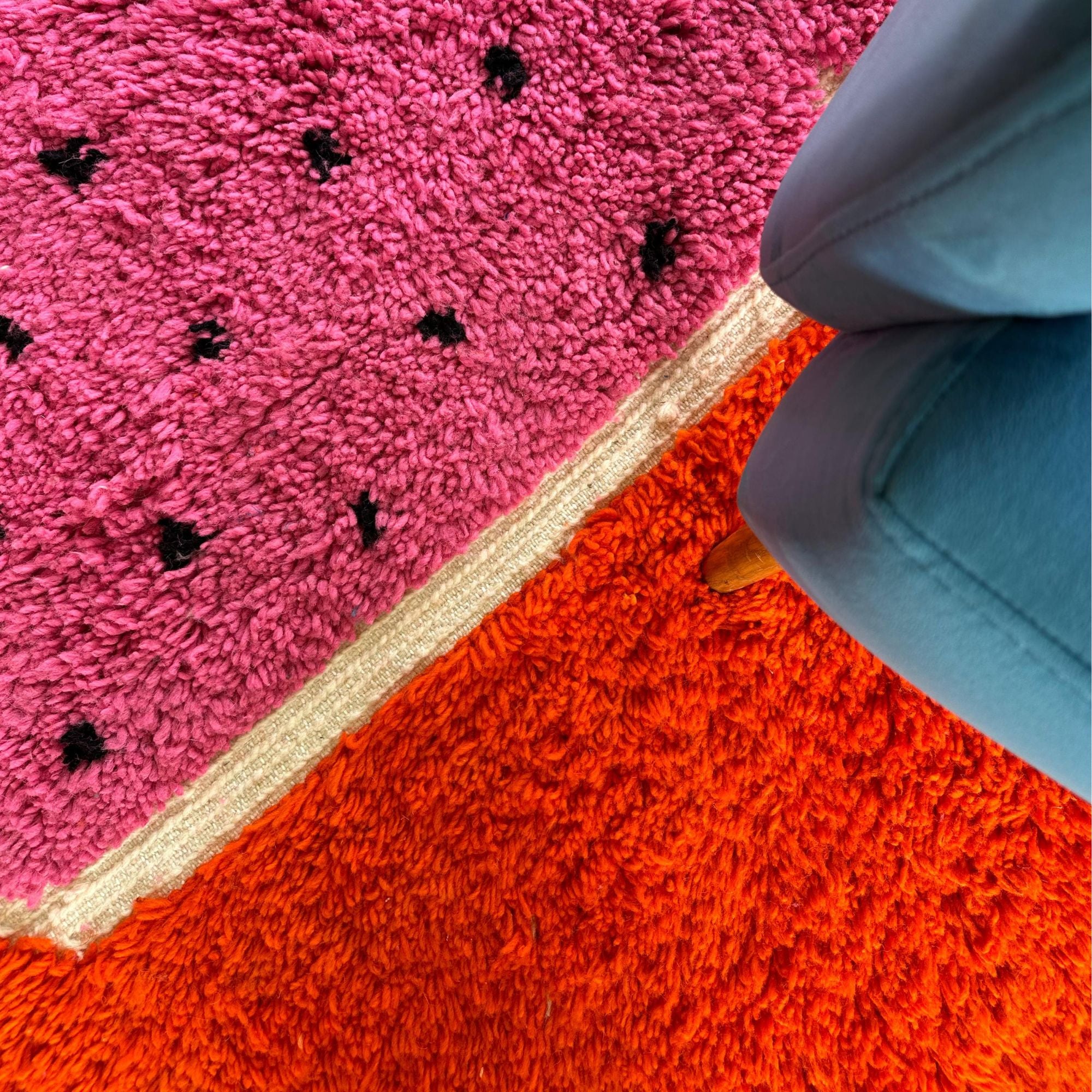 Melon Mirage pink Moroccan rug with a dotted design in black, handwoven by Berber artisans