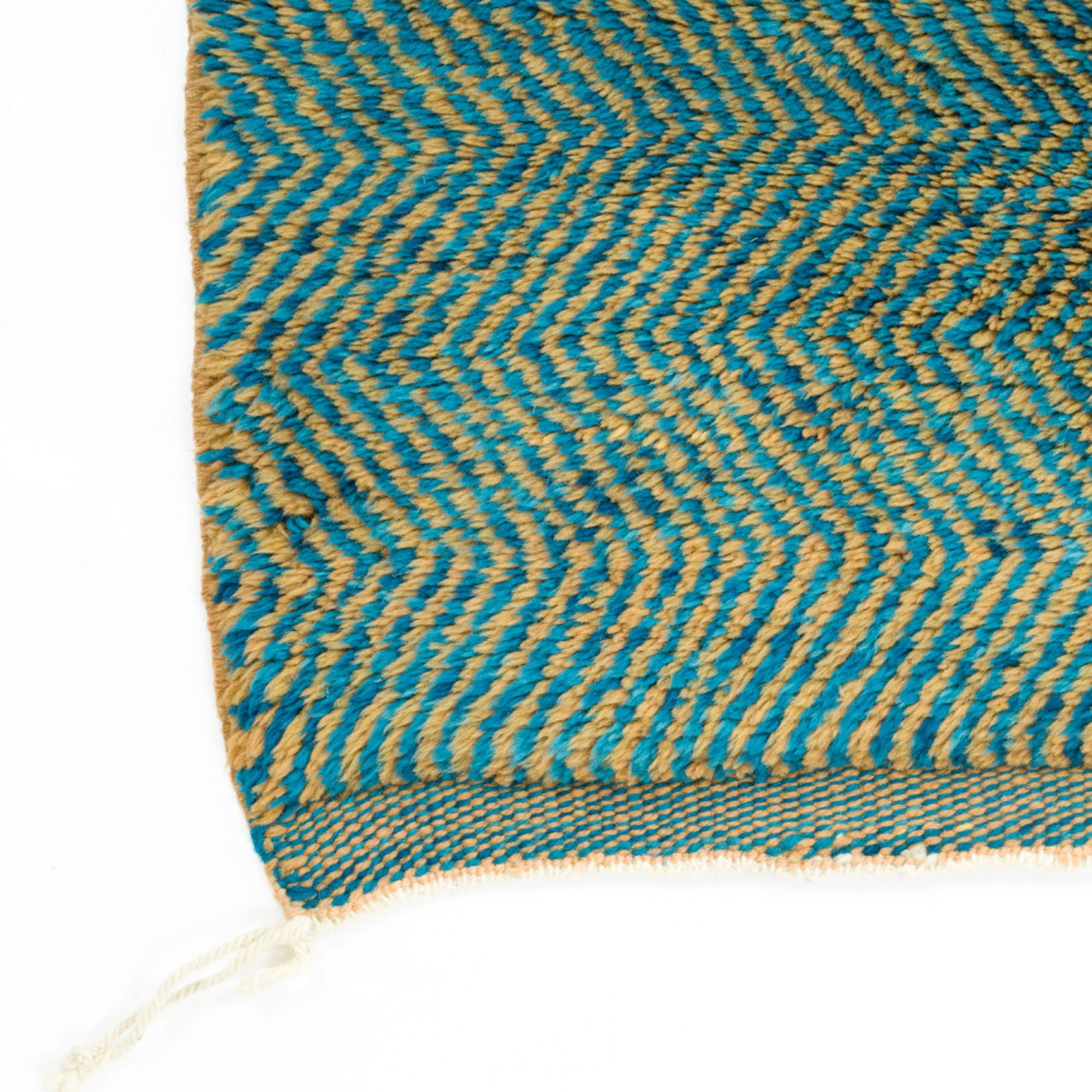 Moroccan Melody blue Moroccan rug with a zigzag design in blue and orange, handwoven by Berber artisans