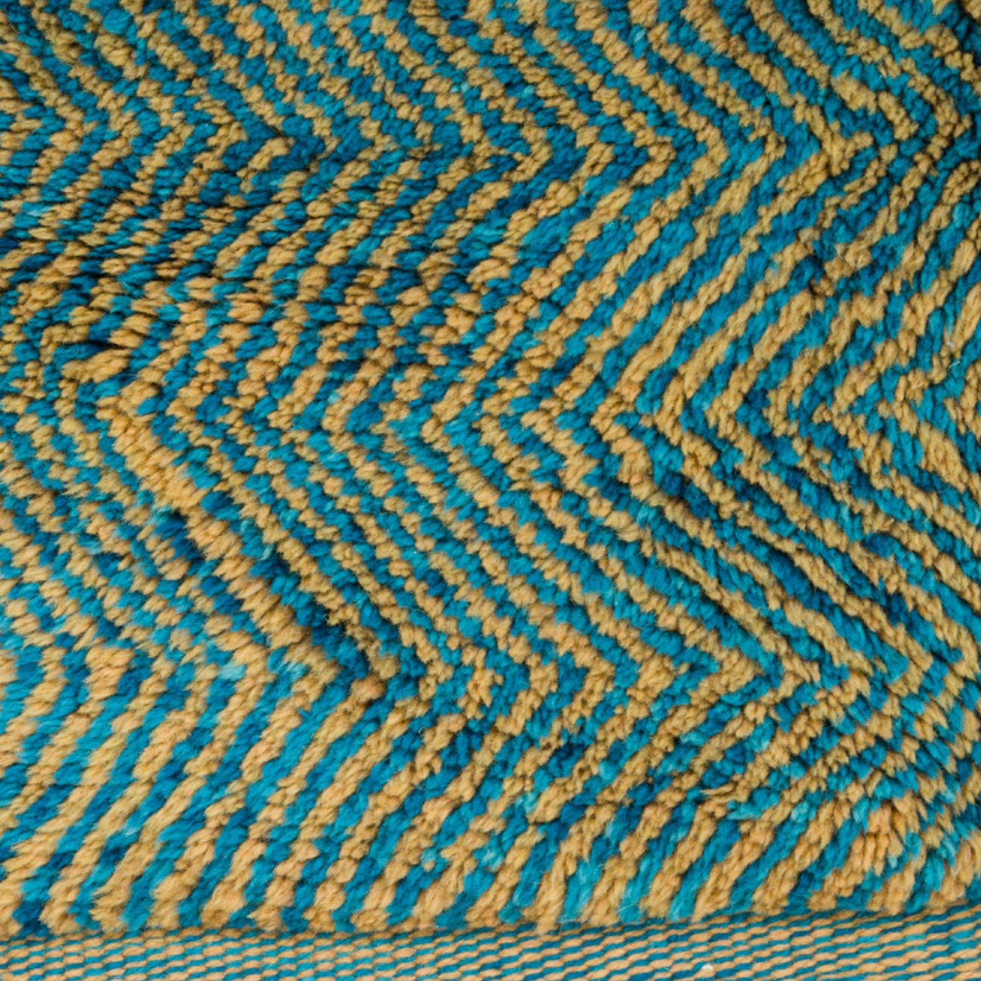 Moroccan Melody blue Moroccan rug with a zigzag design in blue and orange, handwoven by Berber artisans