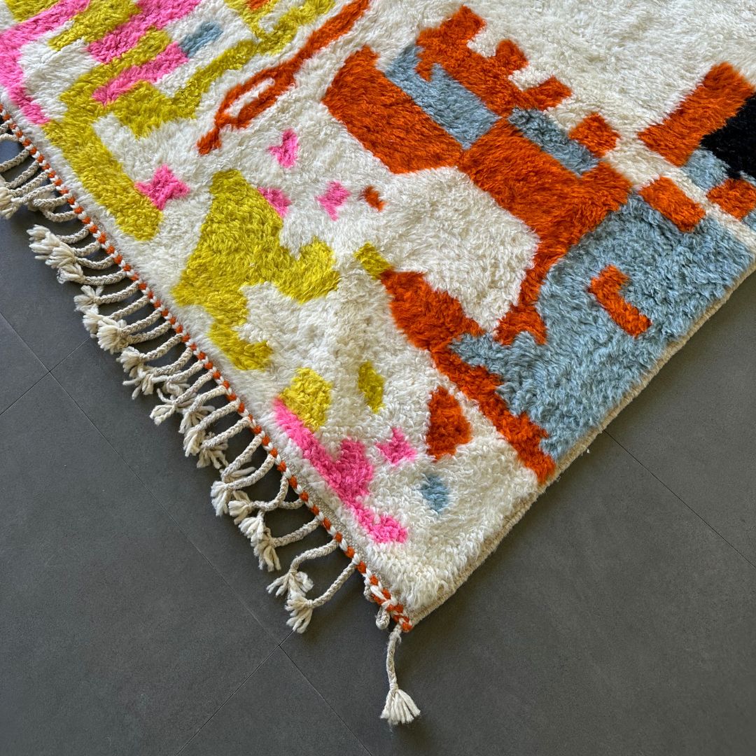 Moroccan Splendor custom Moroccan rug with a contemporary multicolor design on a white canvas, handcrafted by Berber artisans