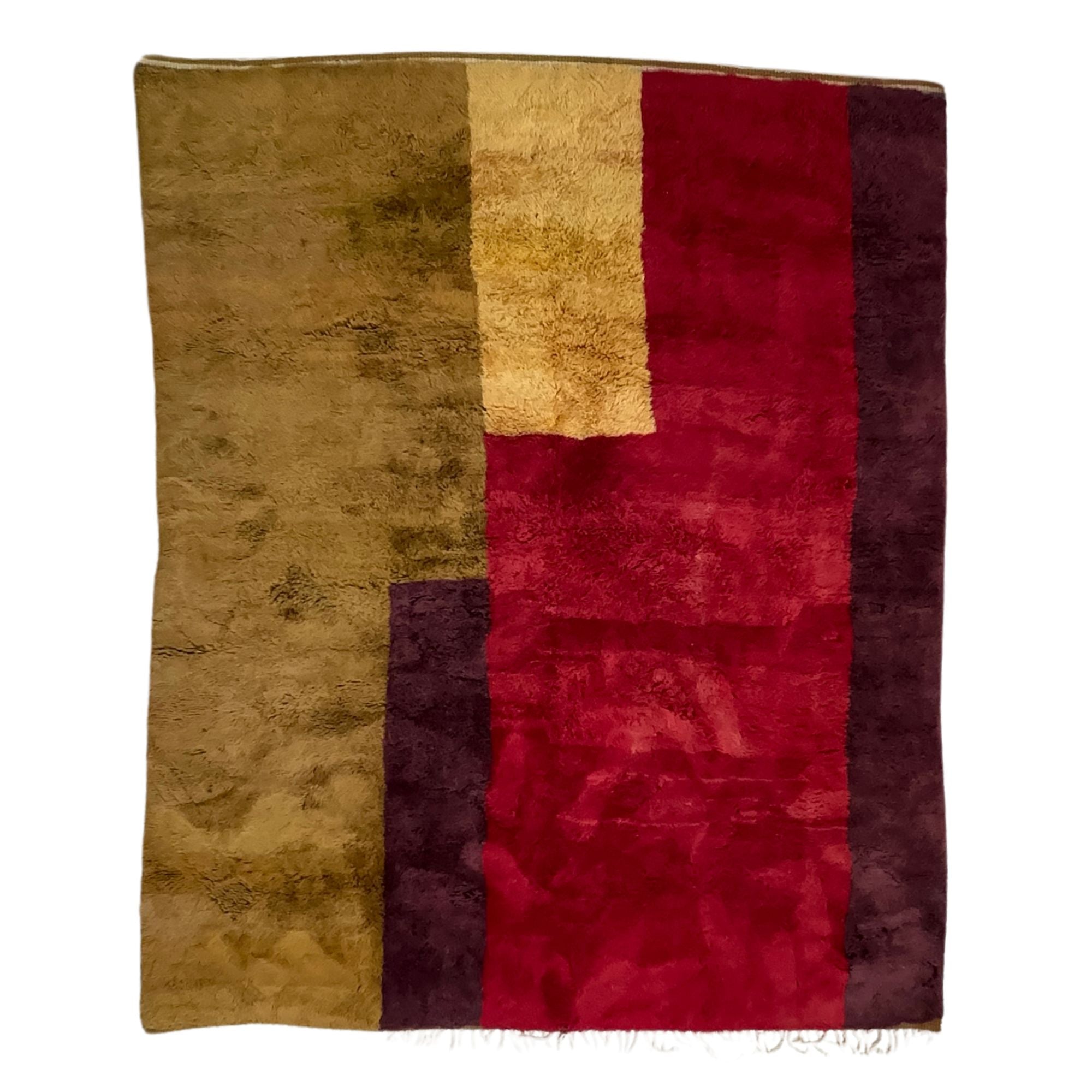  Mystical Marvel – A handcrafted Moroccan area rug featuring bold burgundy, red, and golden hues. A luxurious statement piece inspired by Moroccan landscapes.