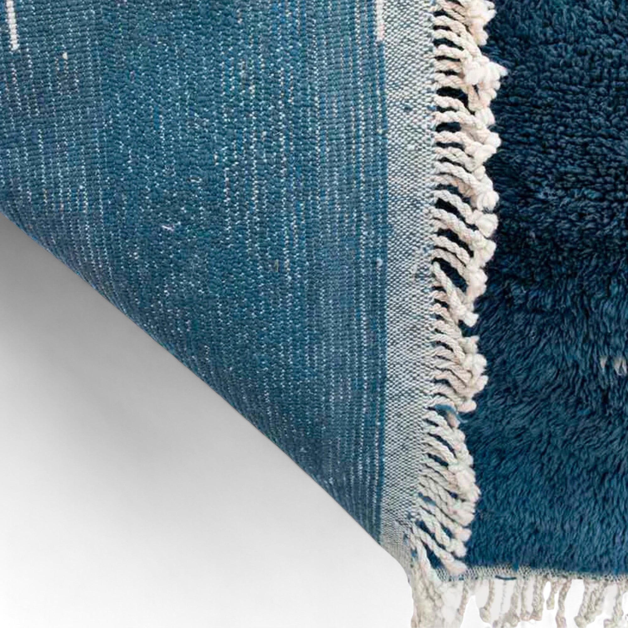 Oasis Elegance blue Moroccan rug with a white abstract design, handwoven by Berber artisans