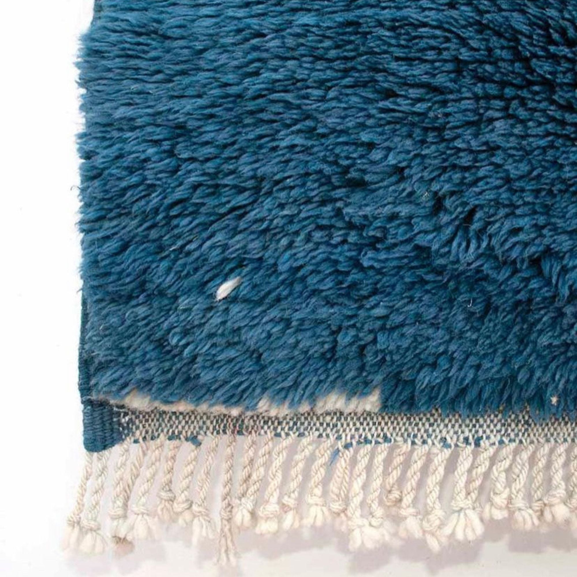 Oasis Elegance blue Moroccan rug with a white abstract design, handwoven by Berber artisans