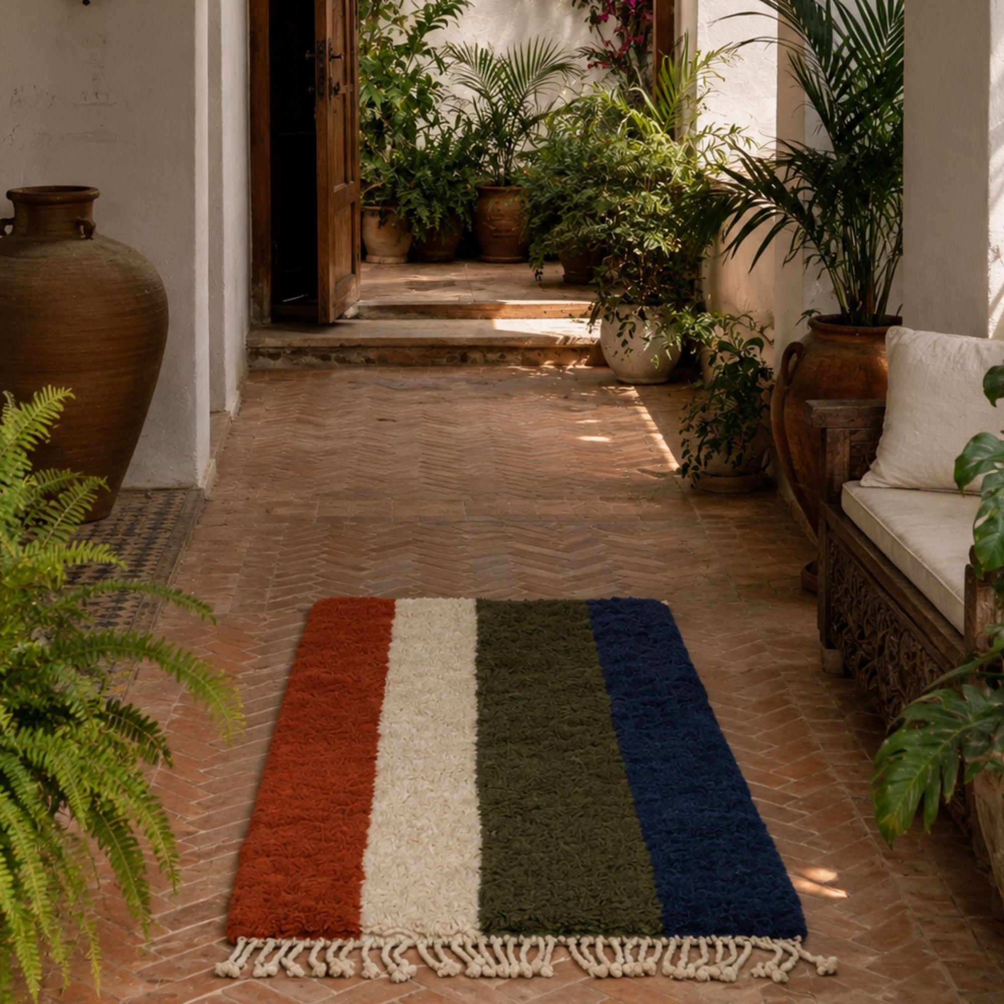 Passage colorful Moroccan wool rug styled in a Mediterranean interior with terracotta flooring