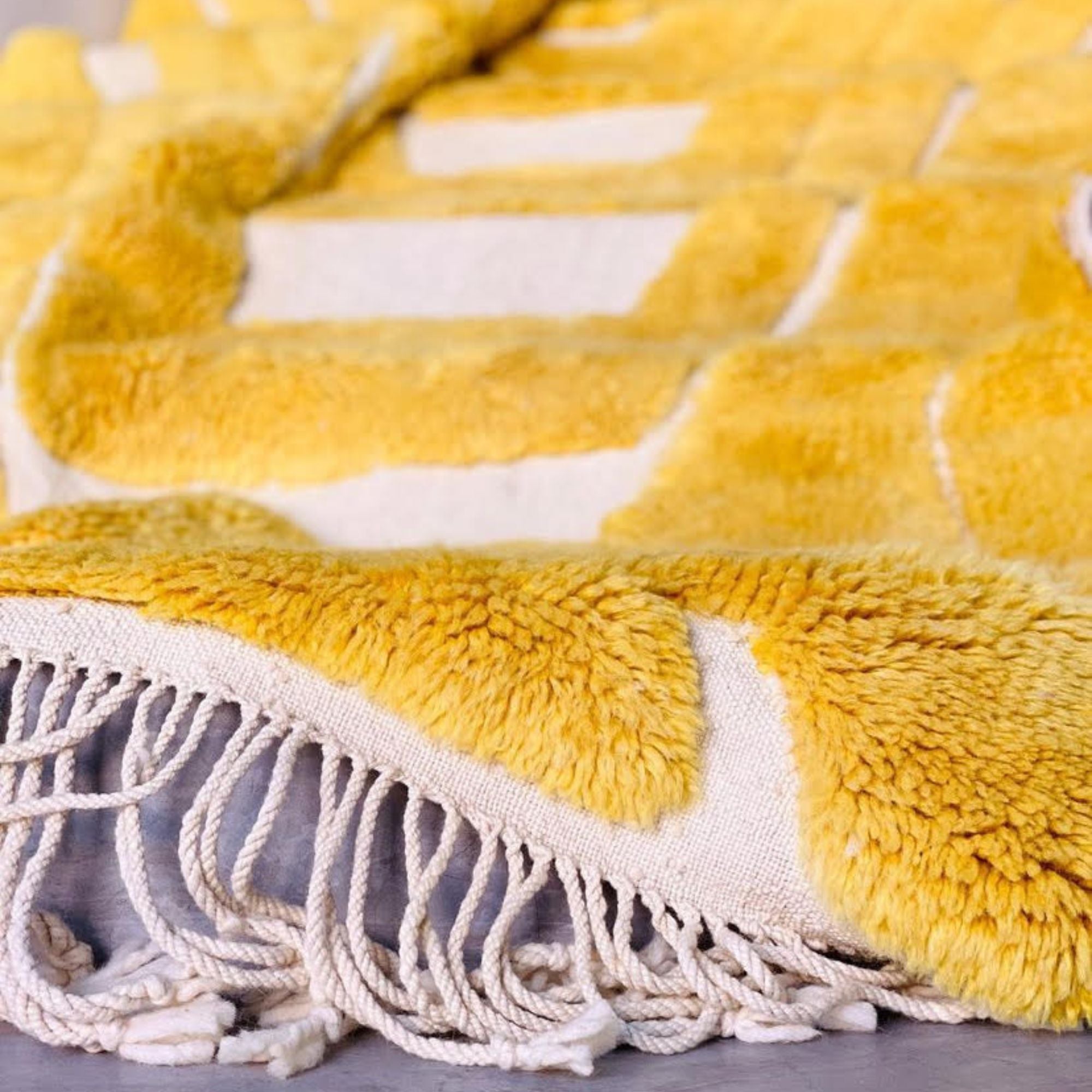 Radiant Realm Moroccan shag rug in vibrant yellow with a beautifully textured design, handwoven by Berber artisans