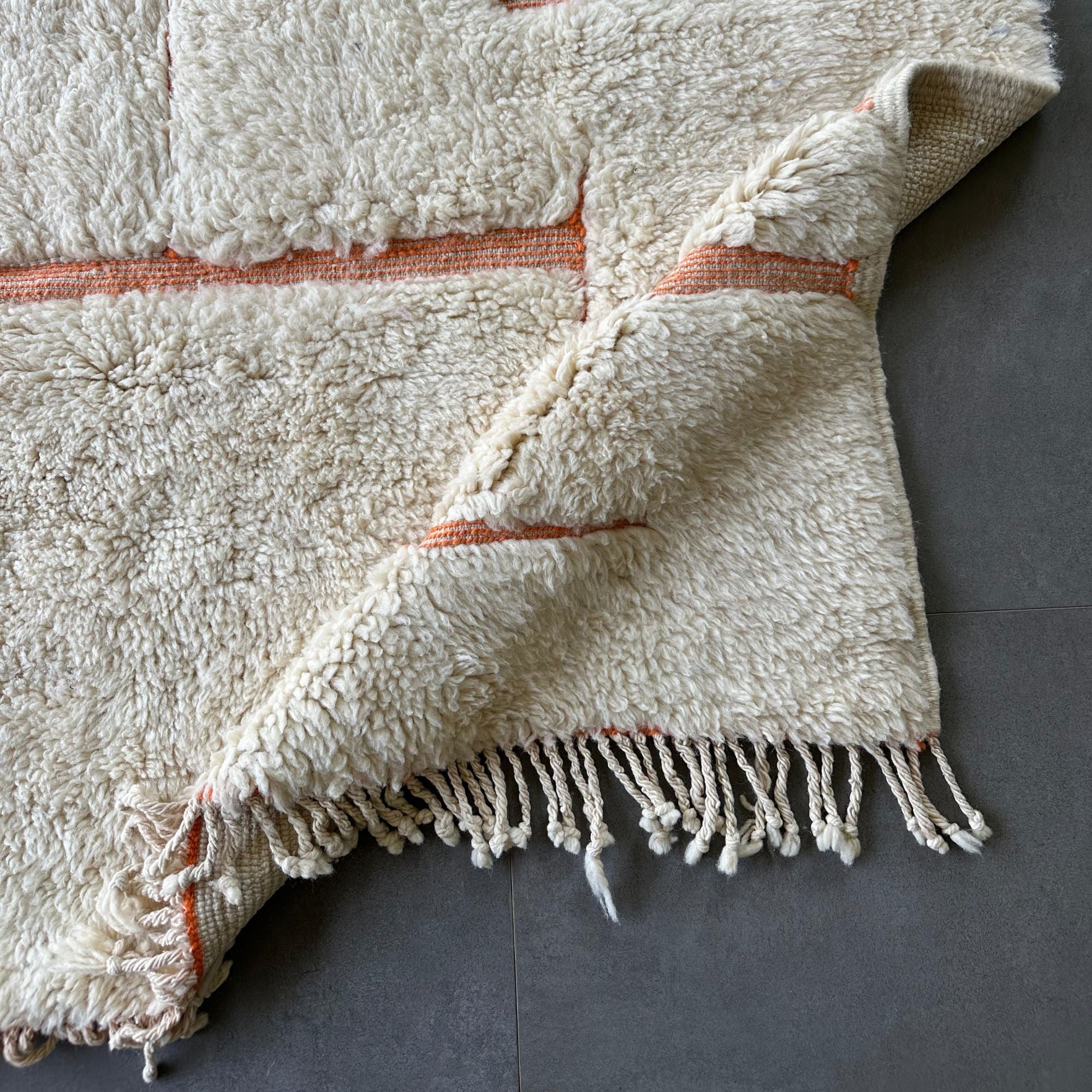 Solstice Serenity white Moroccan rug with a textured pink design, handwoven by Berber artisans