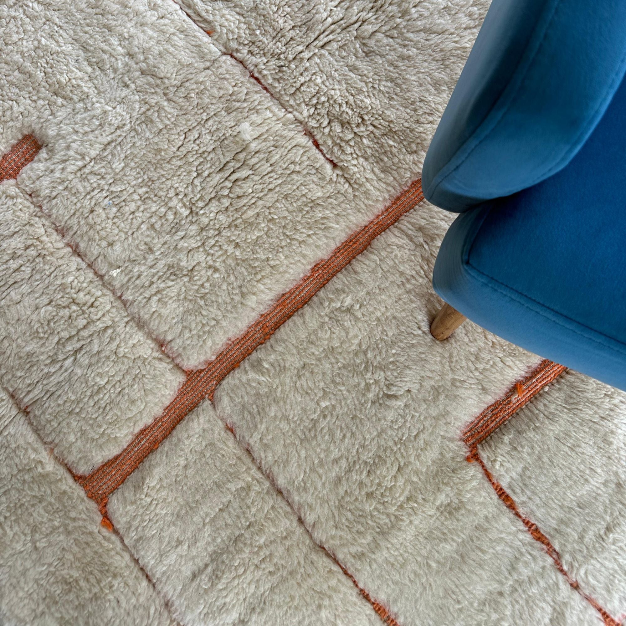 Solstice Serenity white Moroccan rug with pink textured accents, handwoven by Berber artisans.