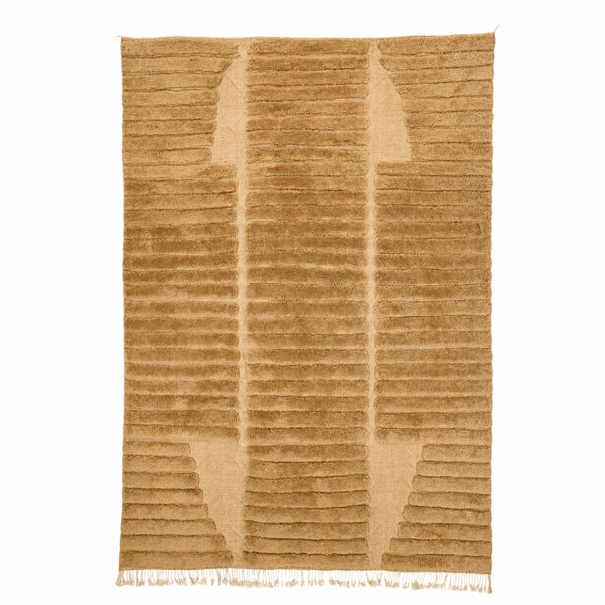 Stratum No. 01 handmade Moroccan wool rug featuring sculptural layered bands in warm camel with high-low textured construction.