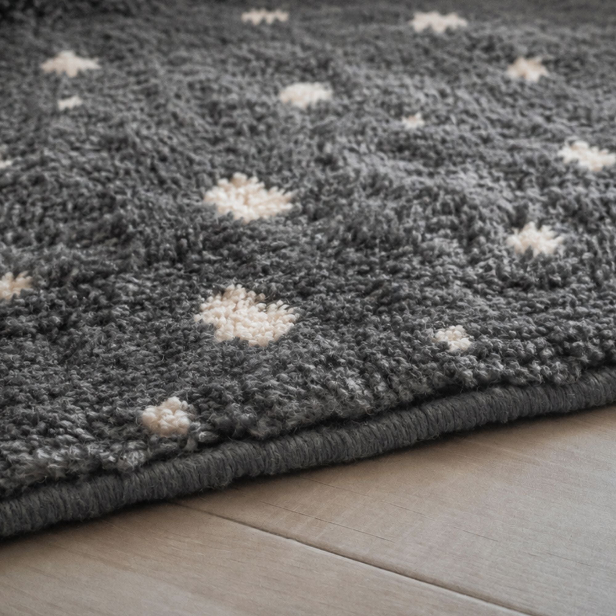 Textured charcoal Moroccan rug handmade from natural wool with scattered ivory abstract motifs