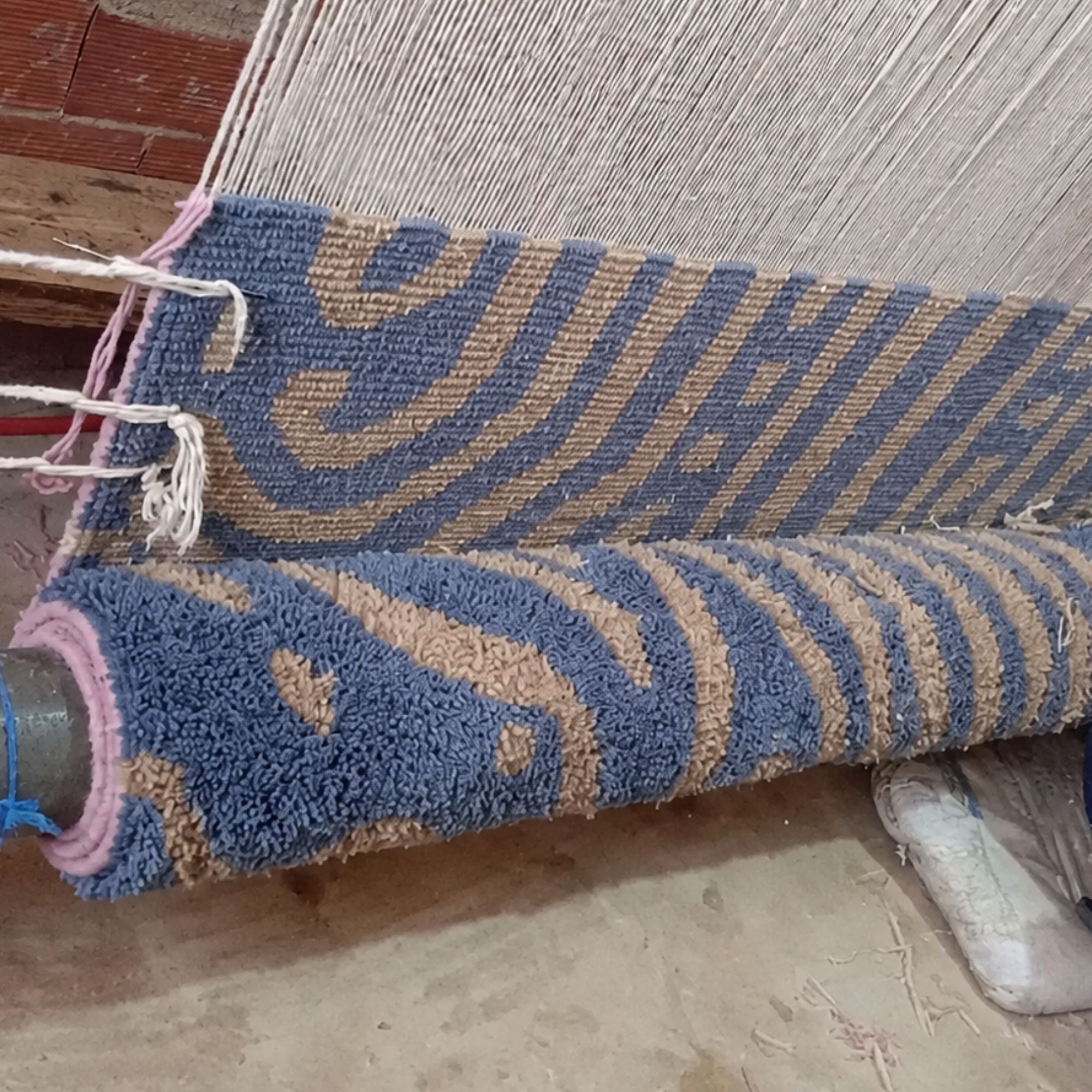 Topography No. 01 Moroccan wool rug being handwoven on a traditional loom in Morocco