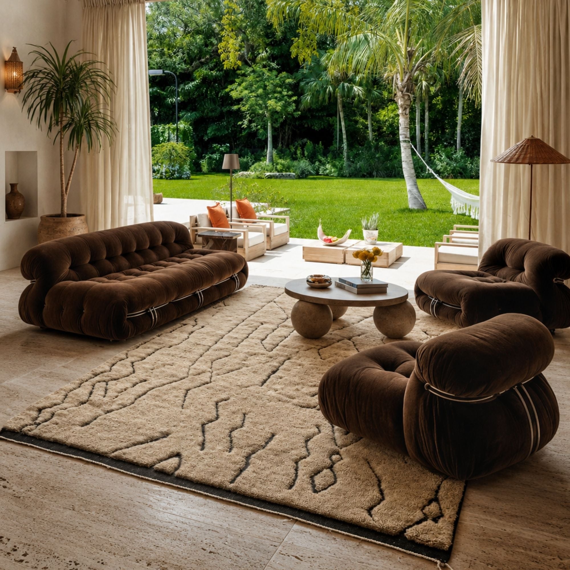Tracks handmade Moroccan wool rug styled in a tropical living room with brown velvet sofas.