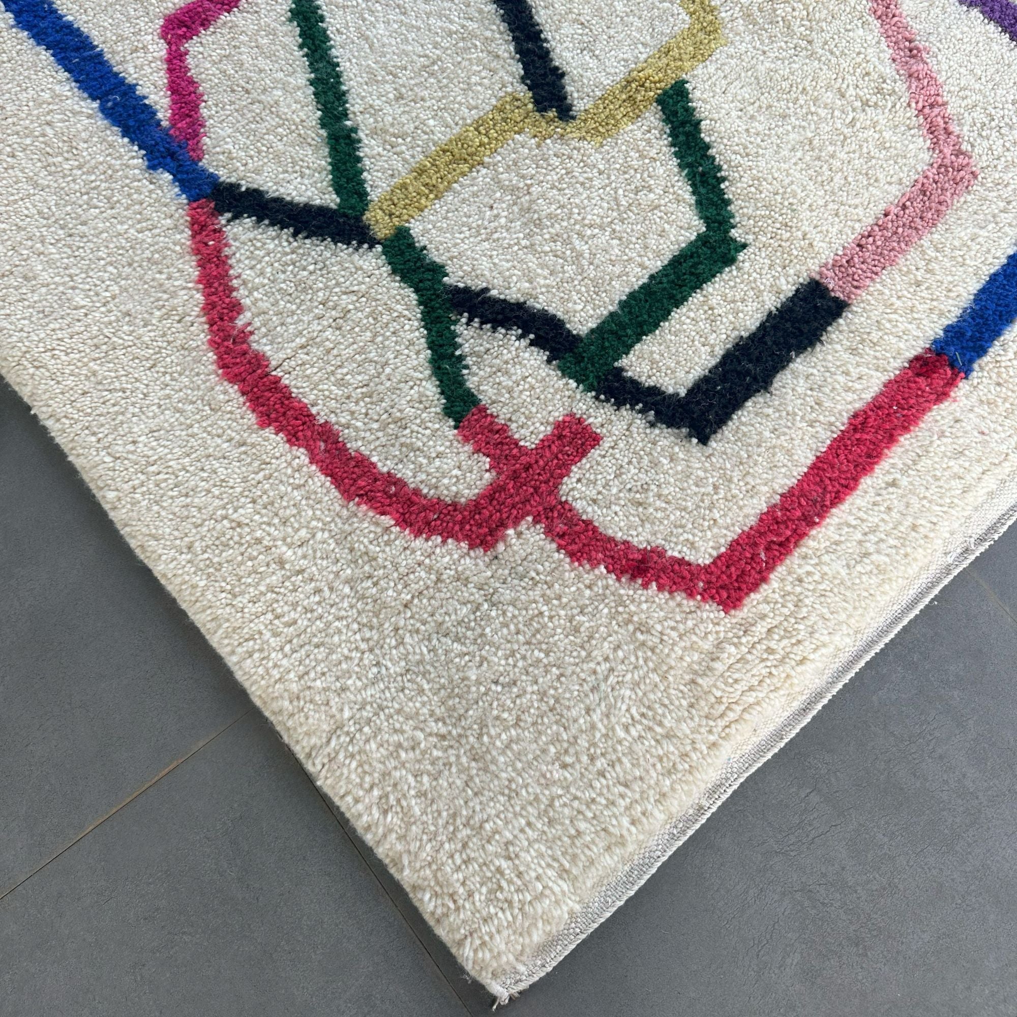 Tranquil Trails white Moroccan rug with colorful contemporary design, handwoven by Berber artisans.