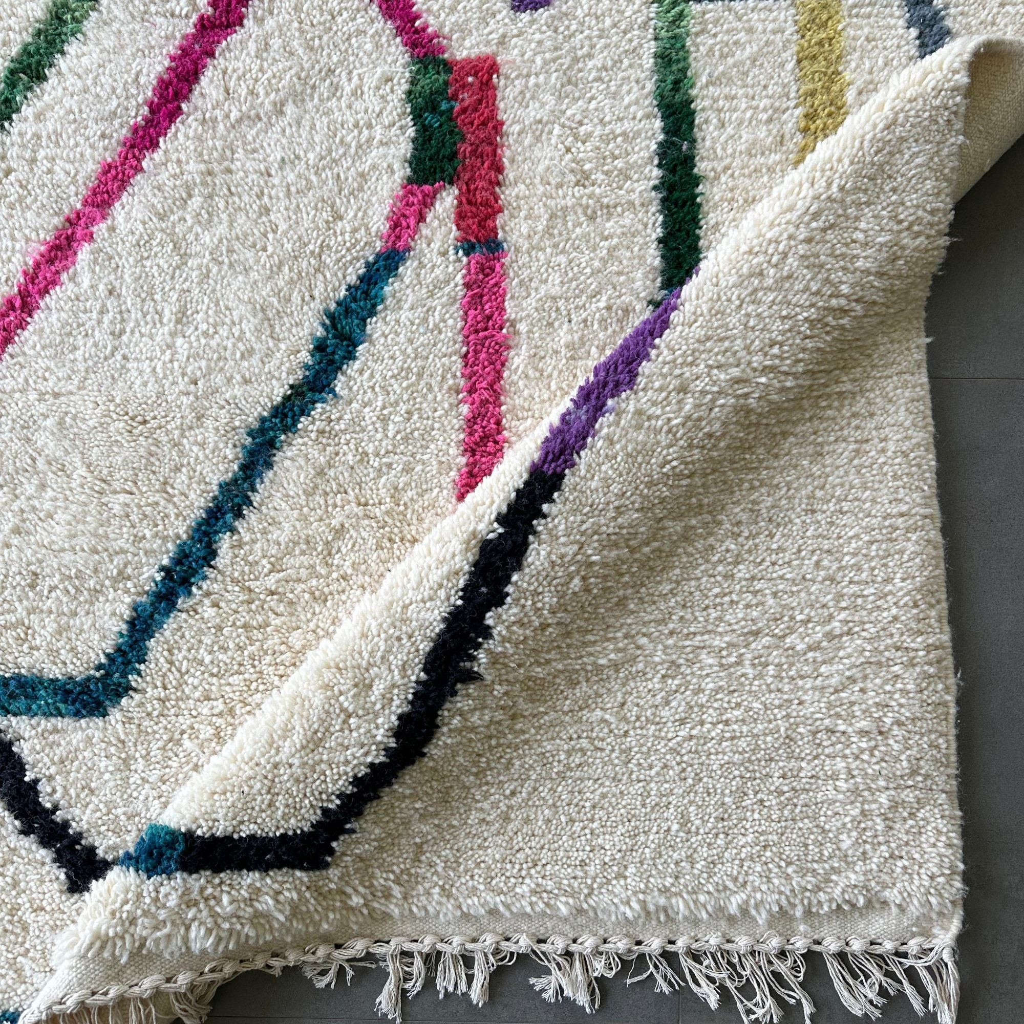 Tranquil Trails white Moroccan rug with colorful contemporary design, handwoven by Berber artisans.