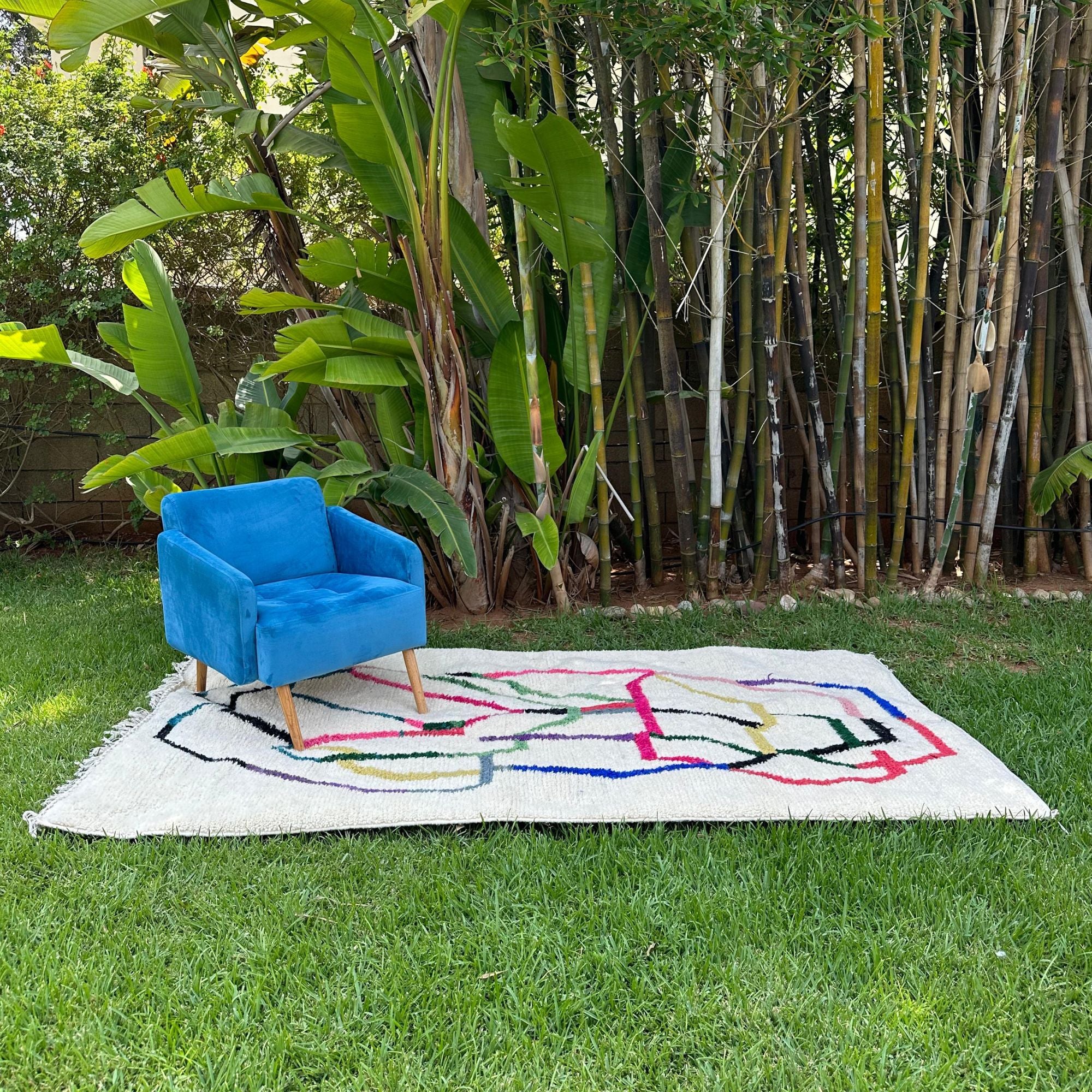 Tranquil Trails white Moroccan rug with colorful contemporary design, handwoven by Berber artisans.