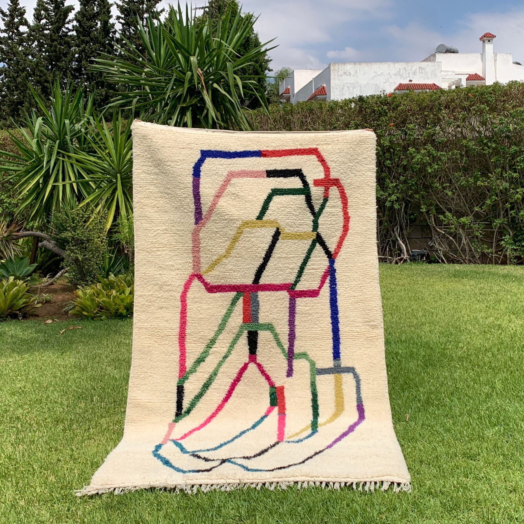 Tranquil Trails white Moroccan rug with colorful contemporary design, handwoven by Berber artisans.