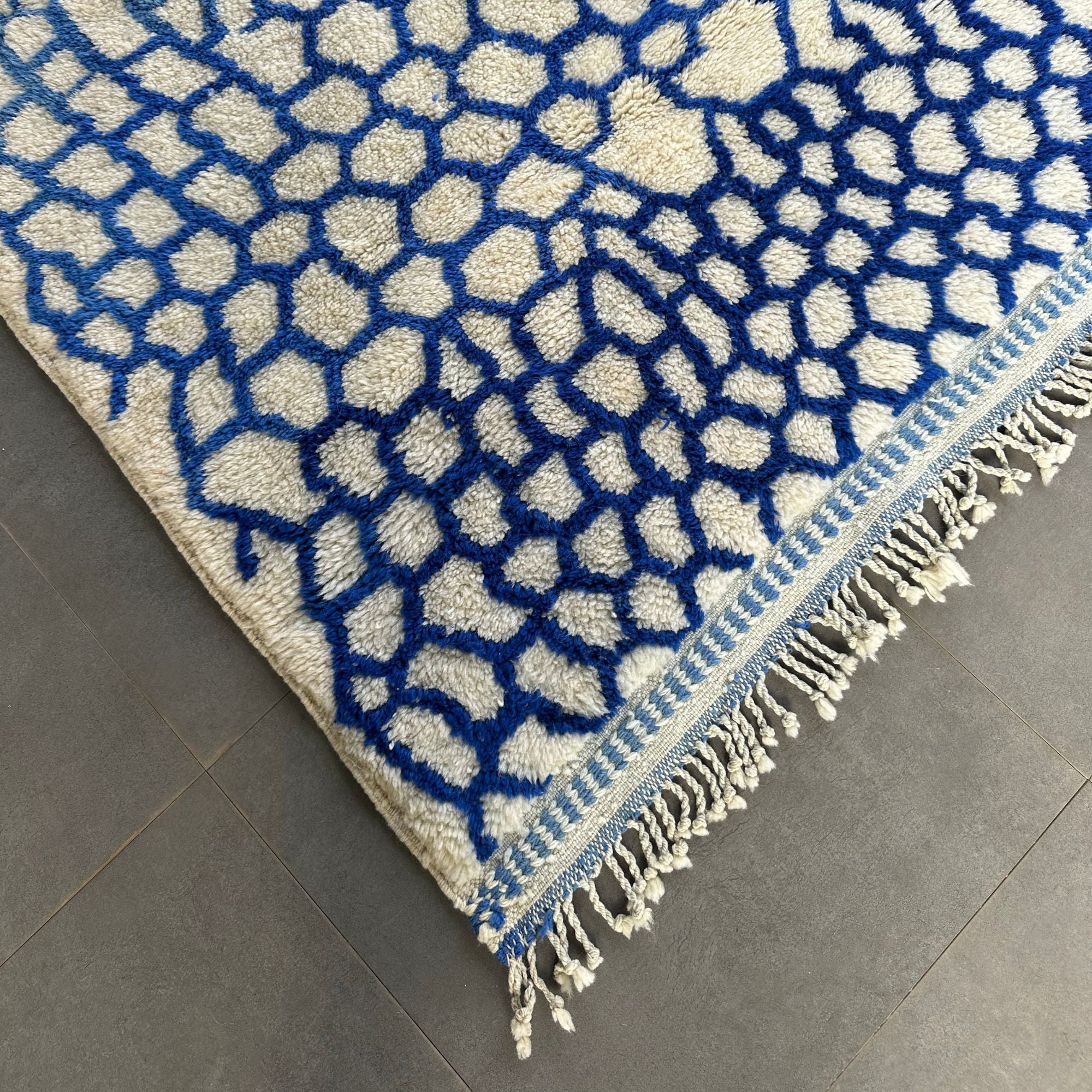 Whispering Willow Moroccan shag rug with a blue honeycomb design, handwoven by Berber artisans