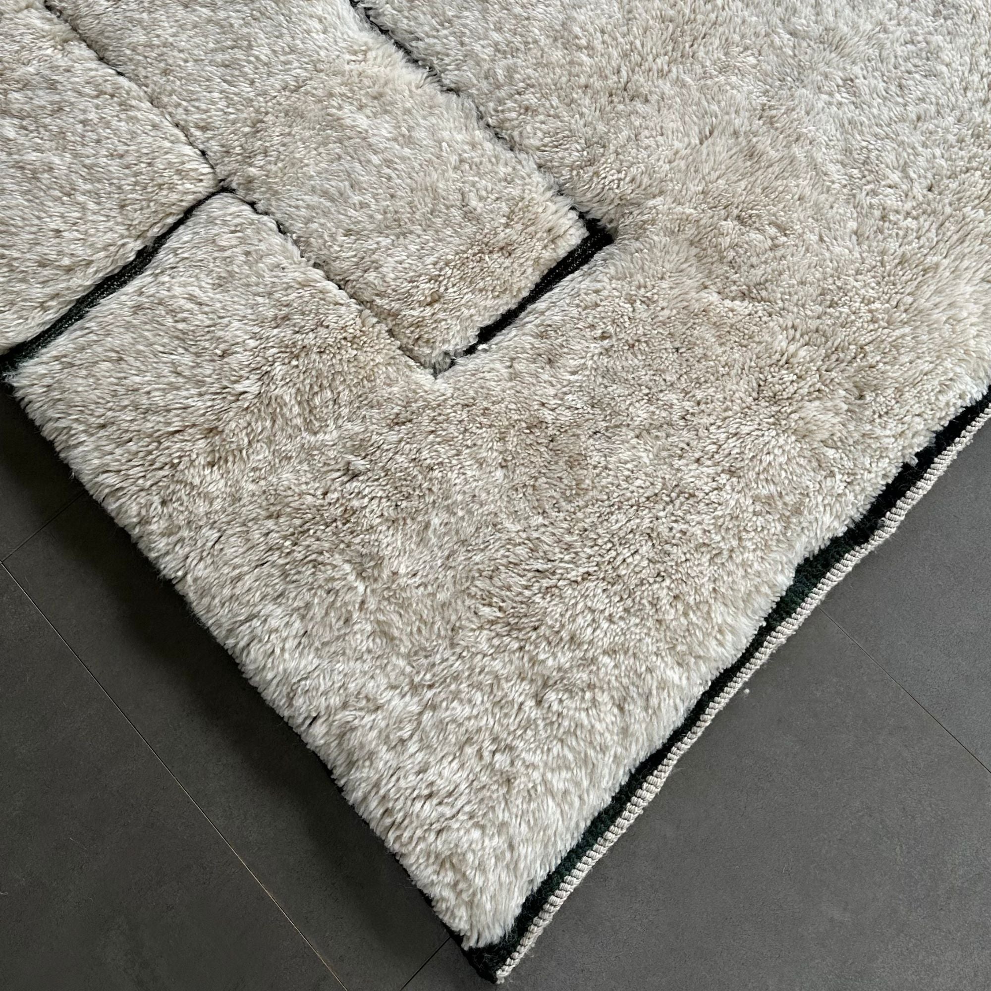 White Moroccan rug with black geometric texture