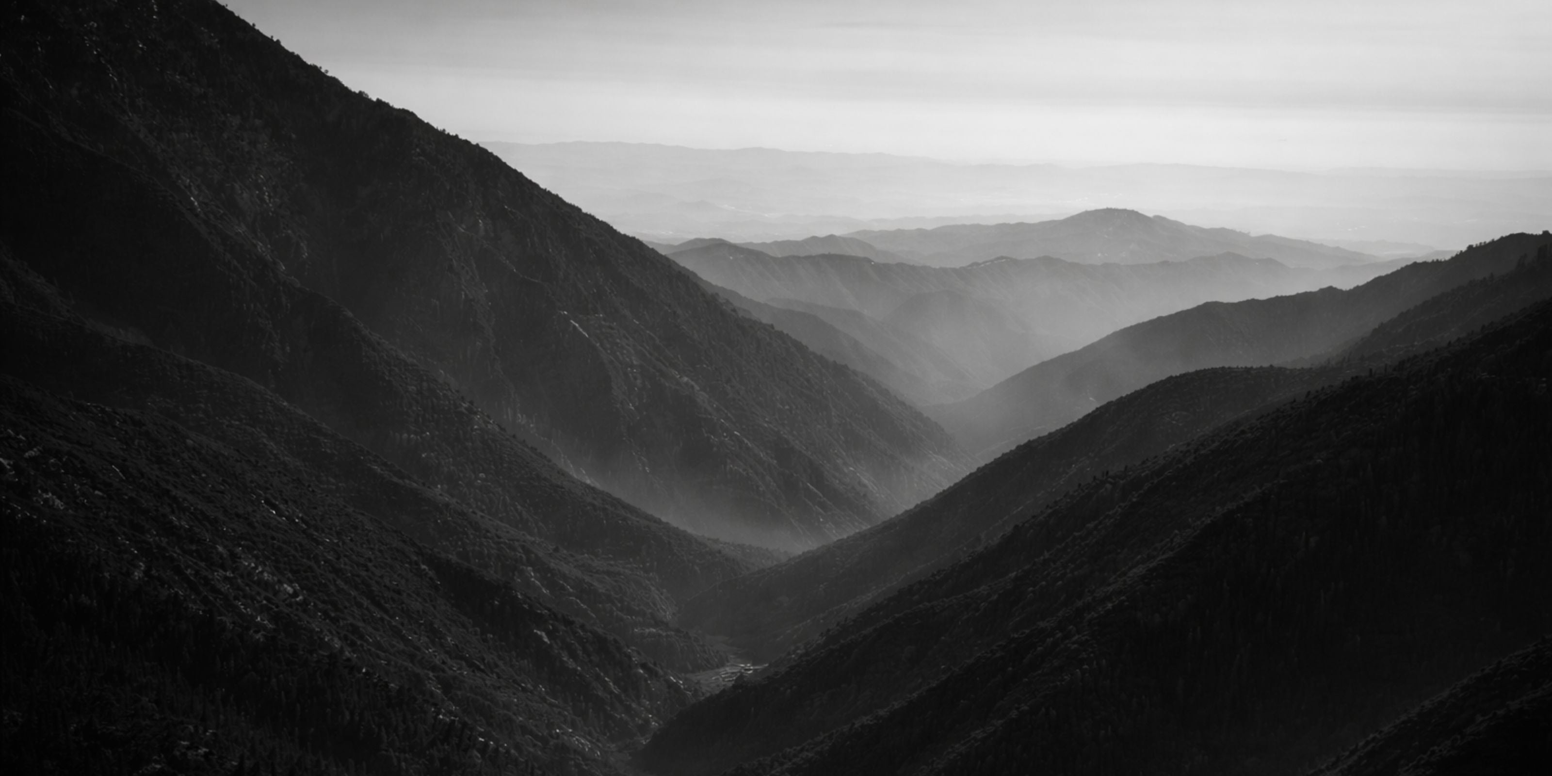 Atlas Mountains landscape in Morocco, origin of handmade Berber rugs crafted using traditional weaving techniques