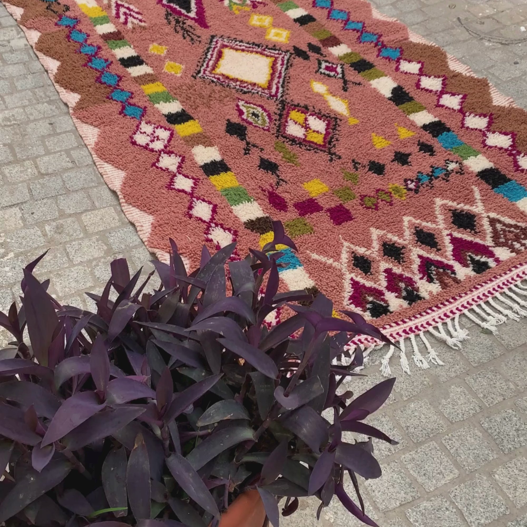 Artisan Treasures pink Moroccan rug with colorful Berber diamond tribal designs and textured sides, handwoven by Berber artisans.