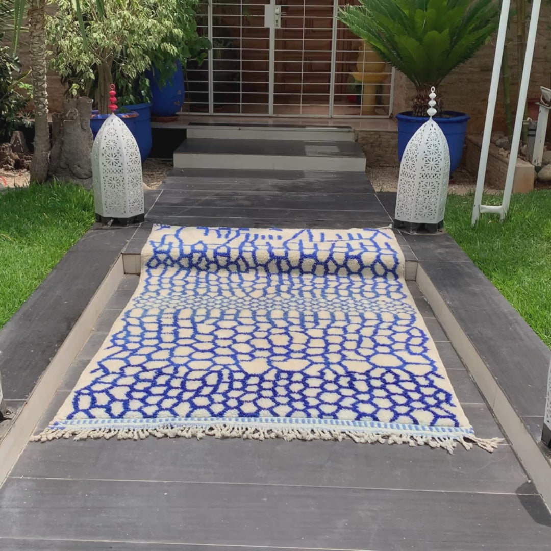 Whispering Willow Moroccan shag rug with a blue honeycomb design, handwoven by Berber artisans