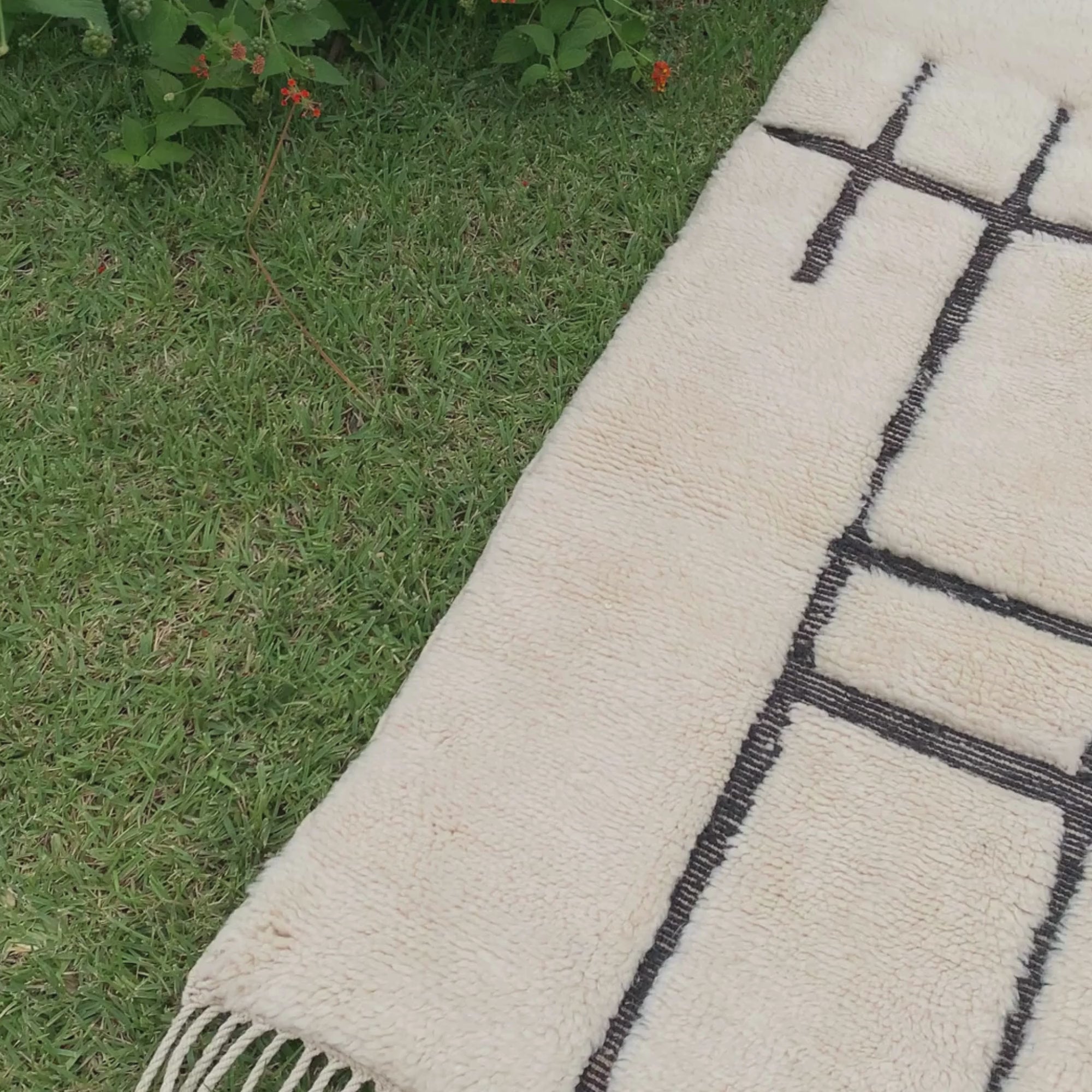 Mystic Muse white Moroccan rug with black geometric design, handwoven by Berber artisans.